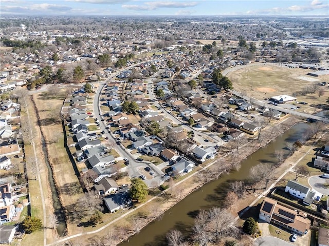 bird's eye view with a residential view and a water view