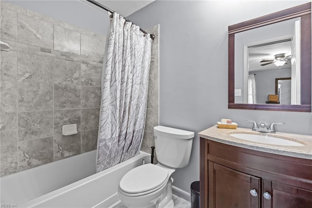 bathroom featuring baseboards, toilet, shower / bath combo, vanity, and a ceiling fan