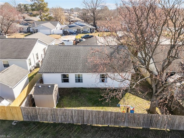 birds eye view of property with a residential view