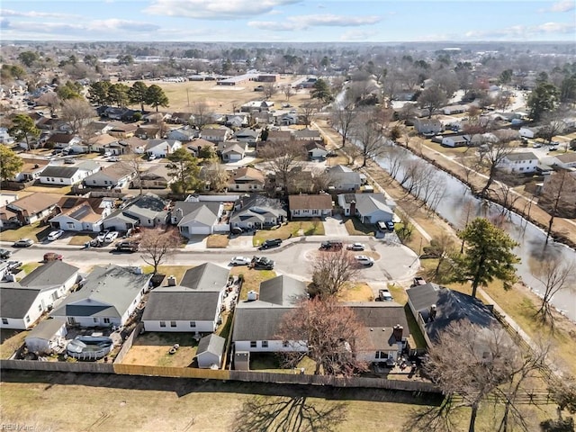 bird's eye view with a residential view and a water view