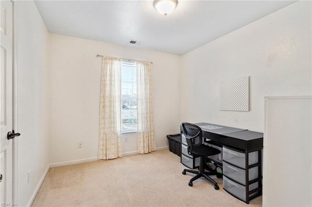 carpeted office featuring baseboards and visible vents