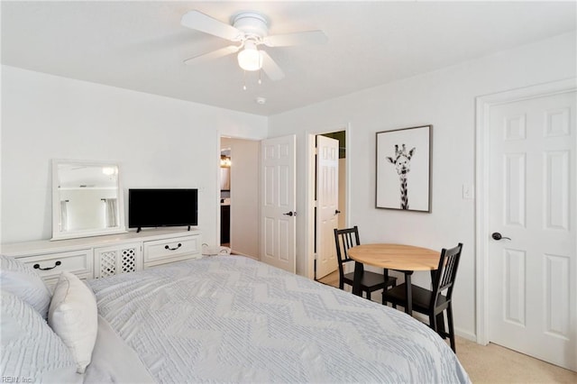 bedroom with light carpet and ceiling fan