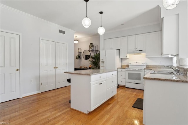 kitchen featuring visible vents, under cabinet range hood, a sink, white appliances, and white cabinets