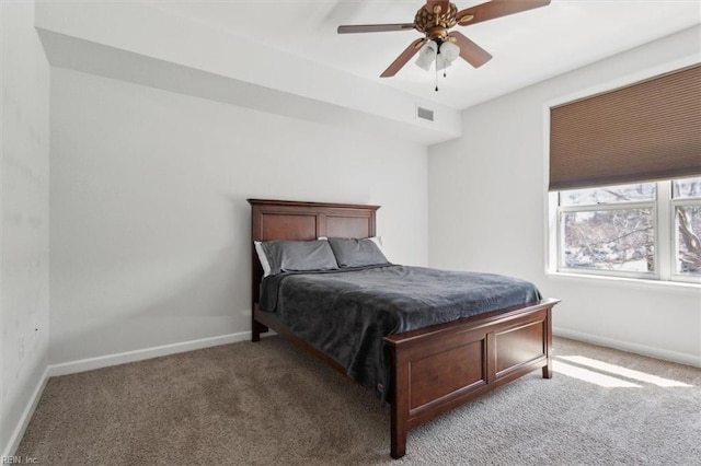 bedroom with visible vents, carpet floors, baseboards, and a ceiling fan