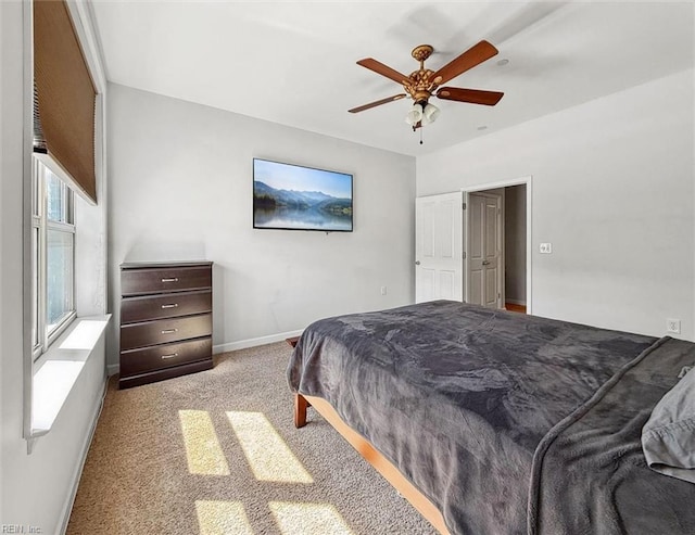 bedroom featuring carpet, baseboards, and ceiling fan