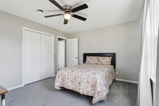 bedroom with ceiling fan, carpet, a closet, and baseboards