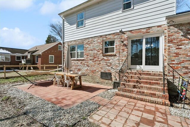 view of patio / terrace featuring fence and entry steps