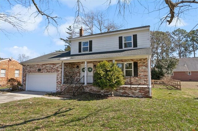 traditional home featuring concrete driveway, an attached garage, brick siding, and a front yard