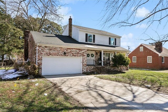 traditional home featuring brick siding, covered porch, a chimney, and a garage