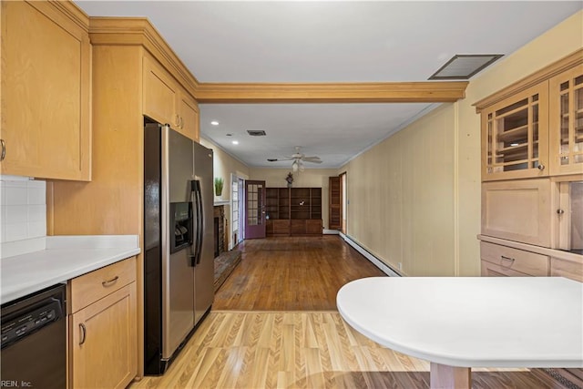 kitchen with visible vents, stainless steel fridge, light wood-style floors, light countertops, and dishwasher