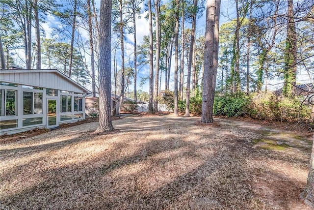 view of yard featuring a sunroom