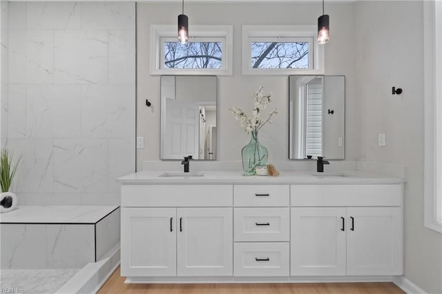 bathroom featuring double vanity and a sink