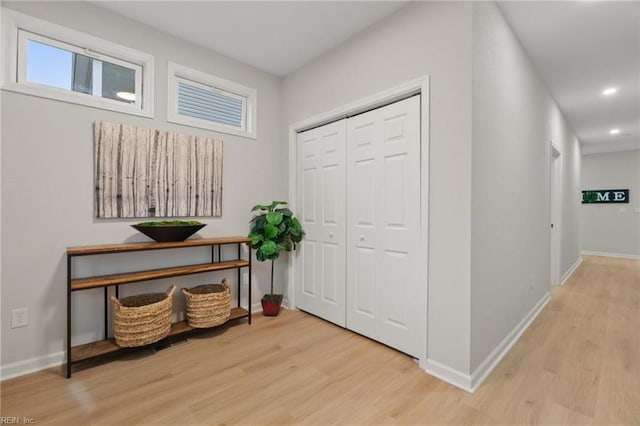 interior space featuring recessed lighting, wood finished floors, and baseboards