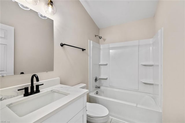 bathroom with vanity, toilet, and shower / bathtub combination