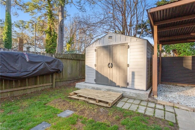 view of shed with a fenced backyard