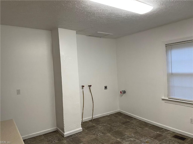 washroom with laundry area, electric dryer hookup, baseboards, and visible vents