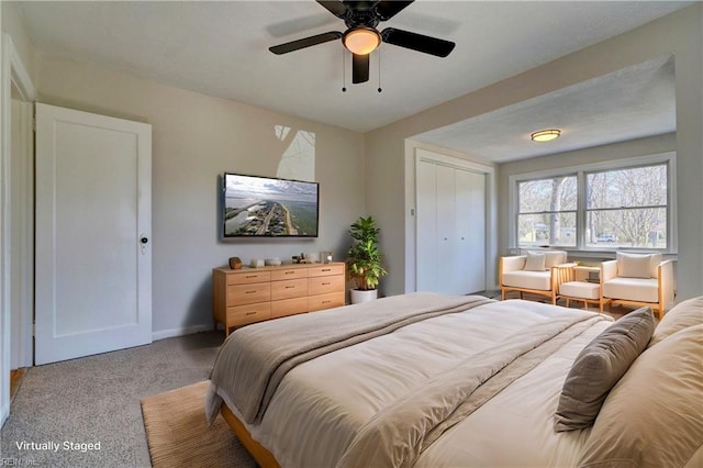 bedroom featuring light carpet, a closet, baseboards, and ceiling fan