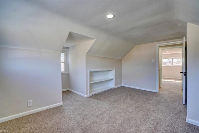 additional living space featuring recessed lighting, baseboards, carpet, and vaulted ceiling