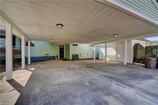 view of patio with cooling unit and fence