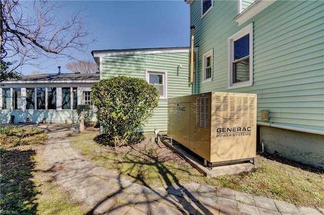 view of home's exterior featuring a sunroom