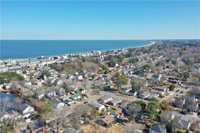 drone / aerial view featuring a water view and a residential view