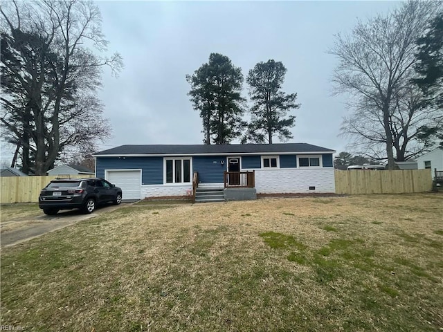 ranch-style home with driveway, a front yard, a garage, and fence