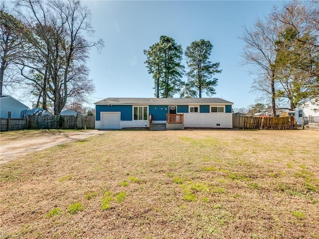 single story home featuring a front yard, an attached garage, fence, and driveway