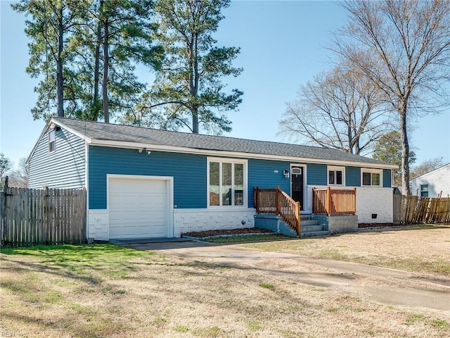 ranch-style house with a front lawn, fence, a garage, stone siding, and driveway