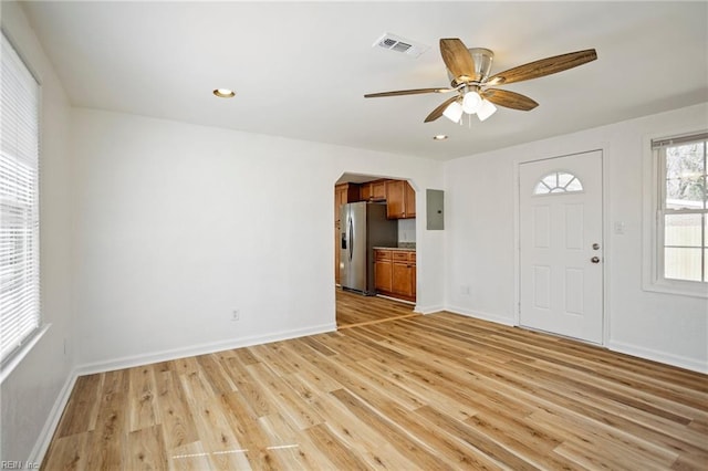 entrance foyer featuring baseboards, visible vents, light wood-style flooring, electric panel, and recessed lighting