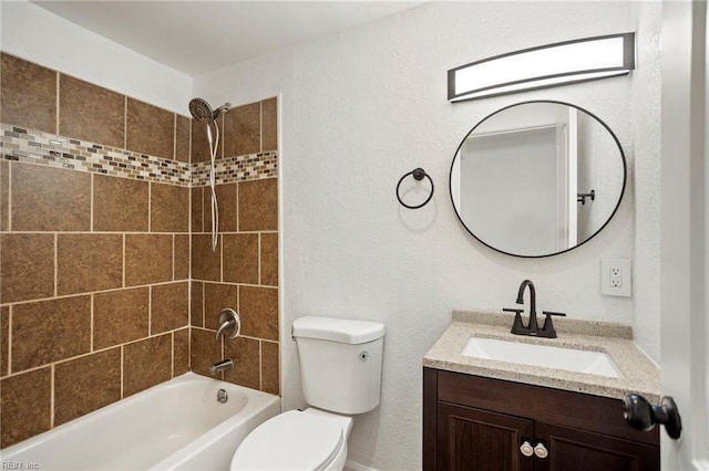 bathroom featuring vanity, toilet, tub / shower combination, and a textured wall