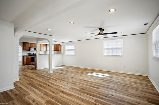 unfurnished living room with recessed lighting, visible vents, light wood-style flooring, and baseboards