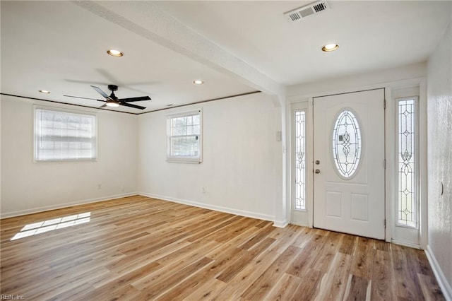 foyer entrance featuring light wood finished floors, visible vents, recessed lighting, and baseboards