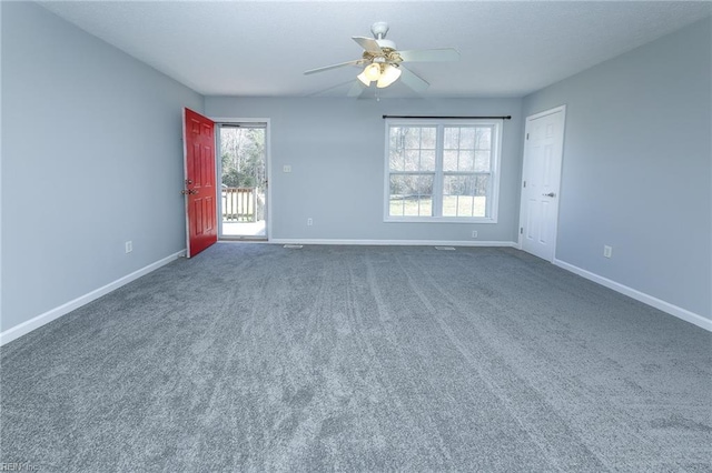 empty room with baseboards, carpet, and a ceiling fan