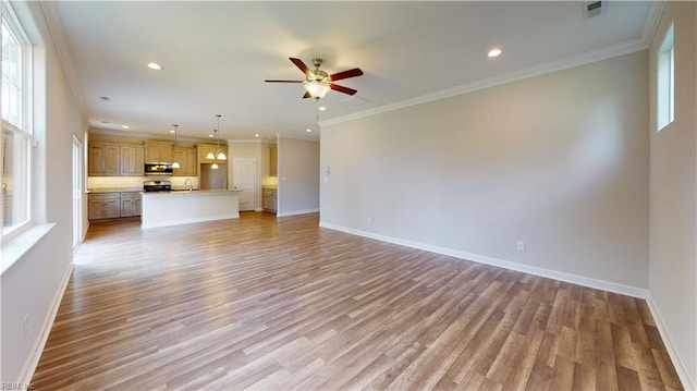 unfurnished living room featuring visible vents, baseboards, recessed lighting, ornamental molding, and light wood-style floors