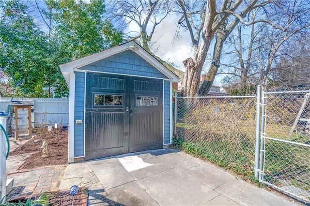 view of shed with a gate and a fenced backyard