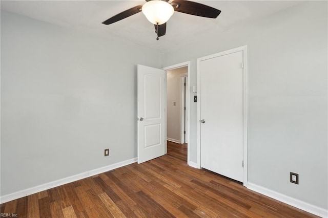 unfurnished bedroom featuring wood finished floors, baseboards, and ceiling fan