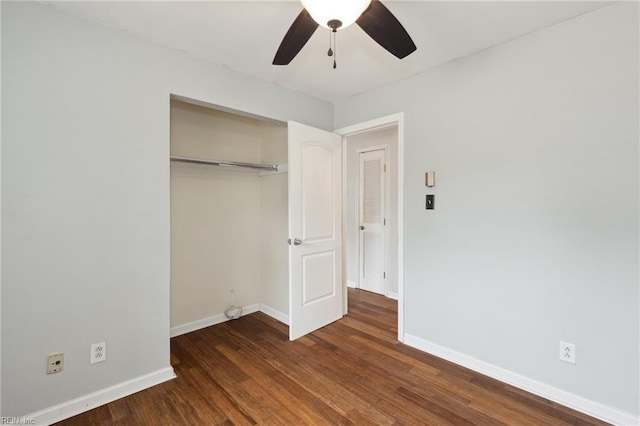 unfurnished bedroom featuring a closet, a ceiling fan, baseboards, and wood finished floors