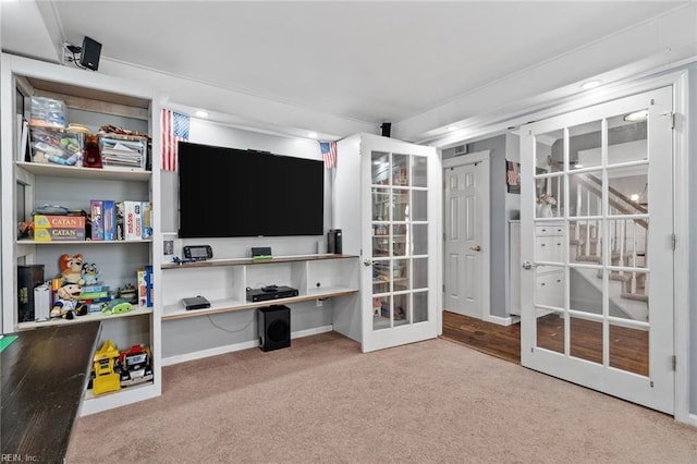 interior space with french doors and carpet flooring