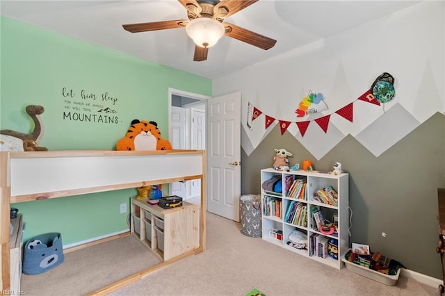 recreation room with carpet floors and a ceiling fan