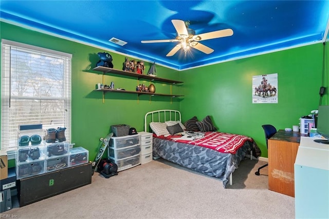 carpeted bedroom with visible vents and ceiling fan