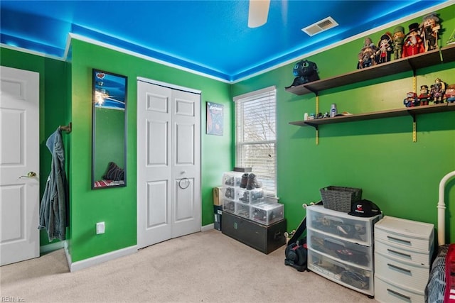 bedroom featuring baseboards, visible vents, carpet floors, and a closet