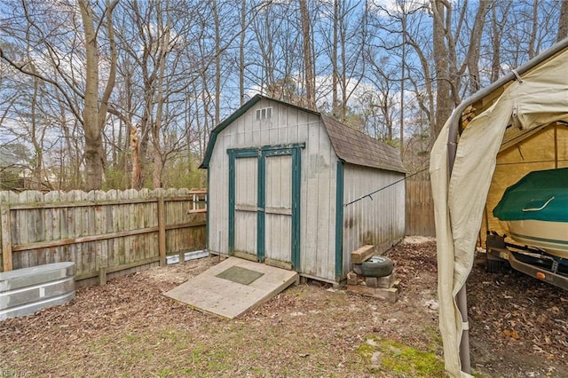 view of shed with a fenced backyard