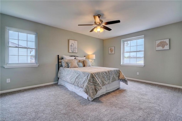 bedroom featuring ceiling fan, baseboards, and carpet floors