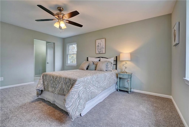 bedroom with a ceiling fan, carpet, and baseboards