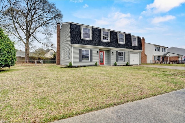 dutch colonial featuring roof with shingles, a chimney, a front yard, and fence