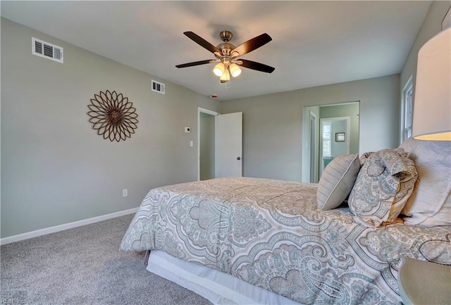 carpeted bedroom featuring visible vents, baseboards, and ceiling fan