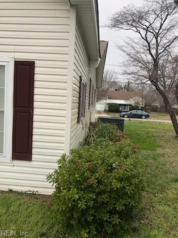 view of home's exterior with a lawn