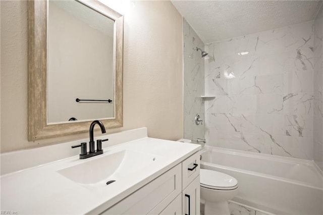 bathroom with toilet, marble finish floor, a textured ceiling, washtub / shower combination, and vanity