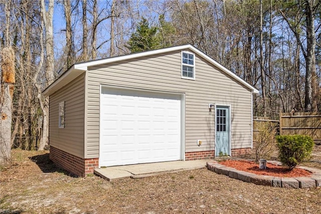 garage with fence