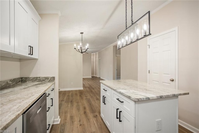 kitchen featuring a notable chandelier, ornamental molding, wood finished floors, a center island, and dishwasher